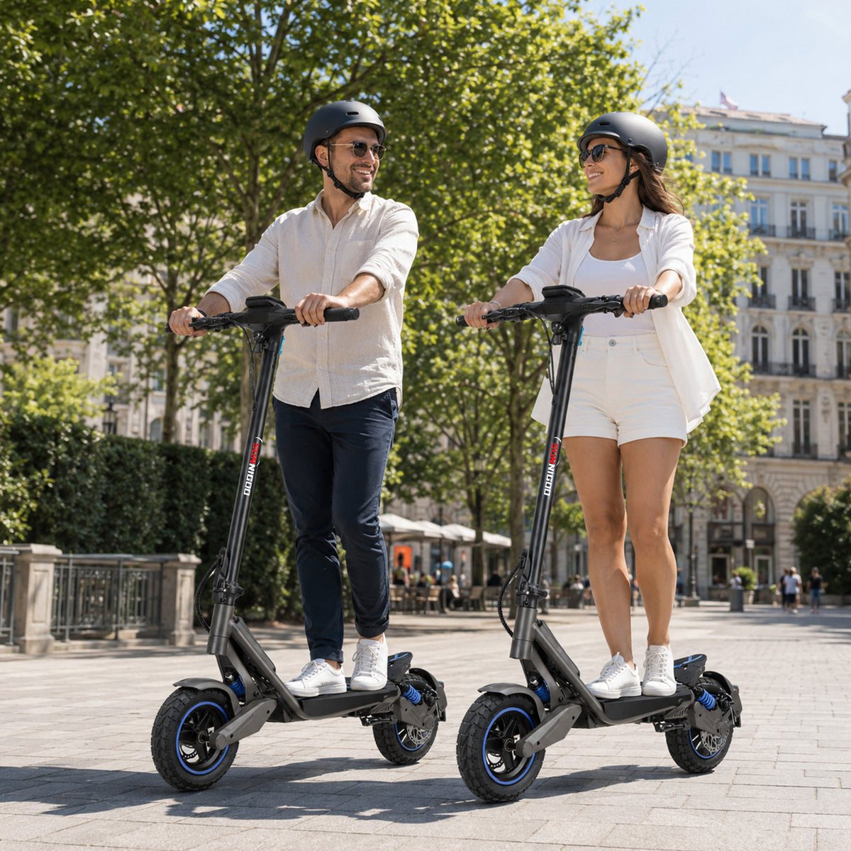Two adults riding SUNNIGOO G7 ABE electric scooters together on a city street